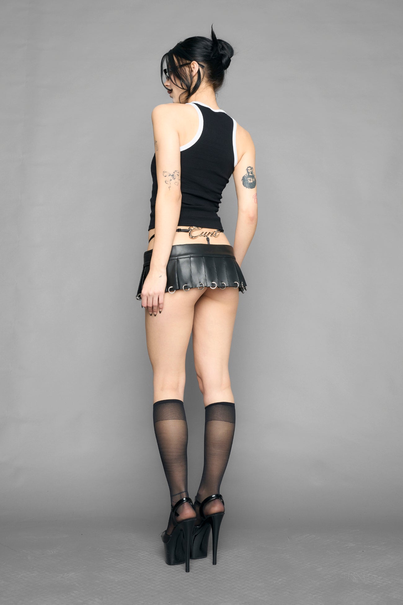 Black tank top with graphic design and text on a gray background