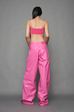 model wearing pink vegan leather croc baggy pants