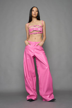 model wearing pink vegan leather croc baggy pants
