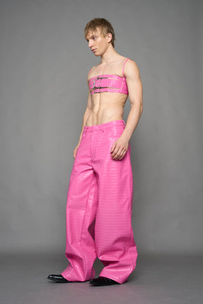 model wearing pink vegan leather croc baggy pants