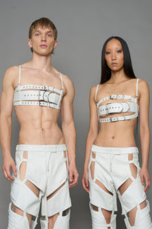 models wearing white vegan leather belt top with buckle details