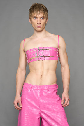 model wearing pink vegan leather croc belt top with buckle details