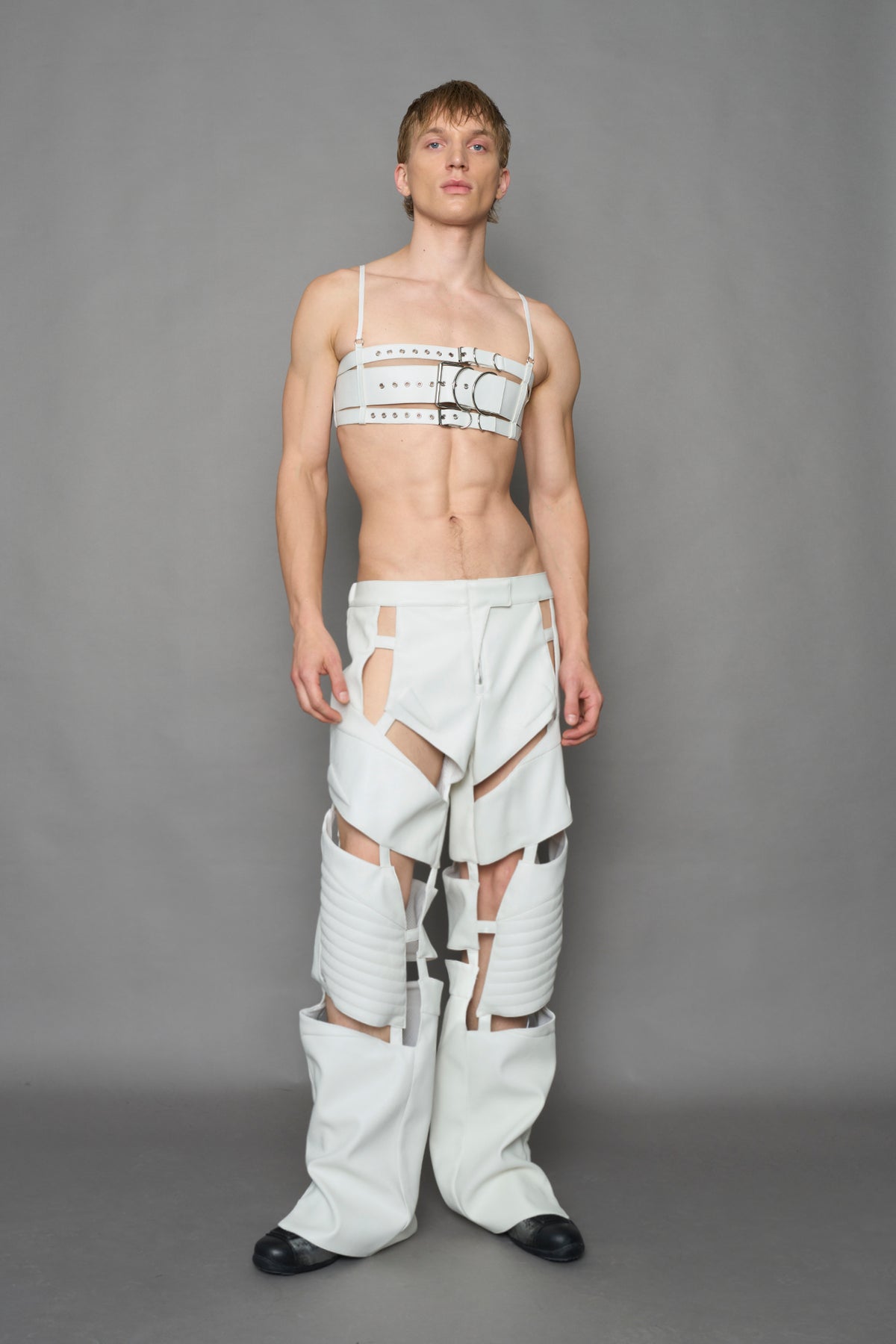 model wearing white vegan leather croc floating pants
