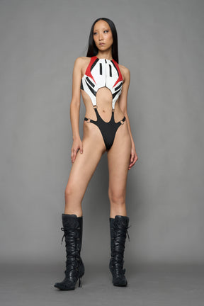 model wearing red white black moto inspired cut out body