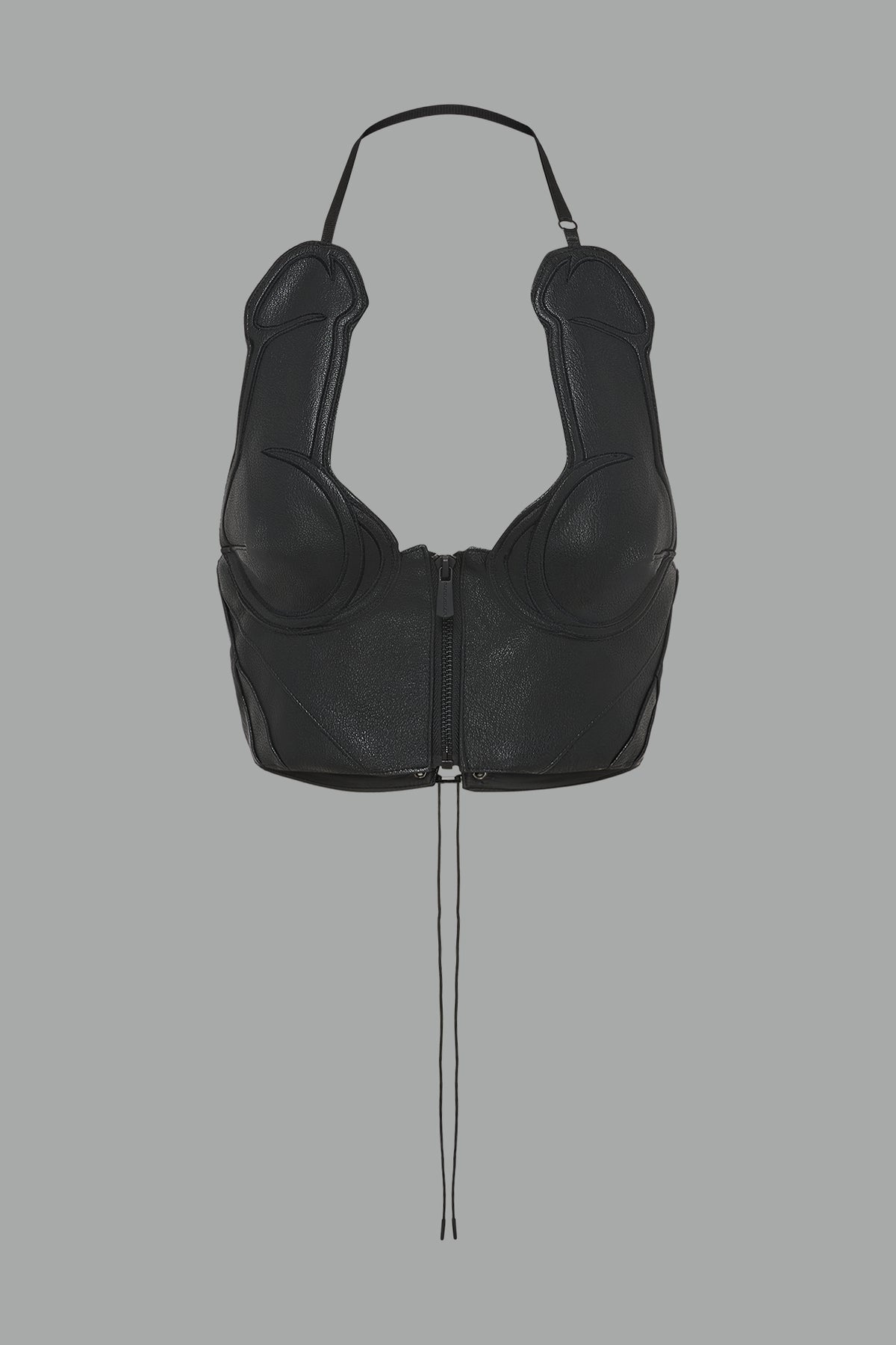 bold black vegan leather statement halter top with provocative cup design and front zipper, paired with matching pants – futuristic streetwear look