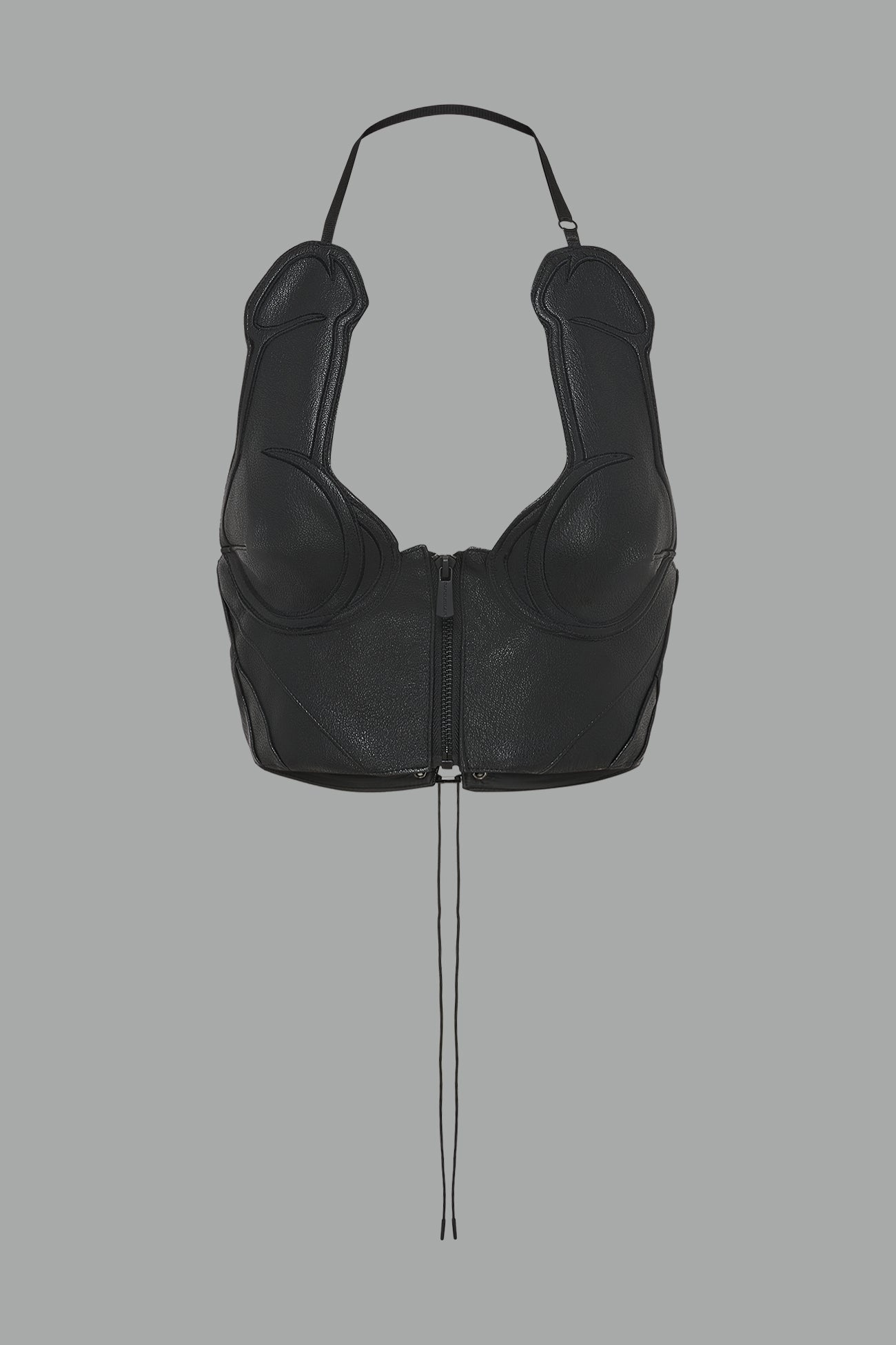 bold black vegan leather statement halter top with provocative cup design and front zipper, paired with matching pants – futuristic streetwear look