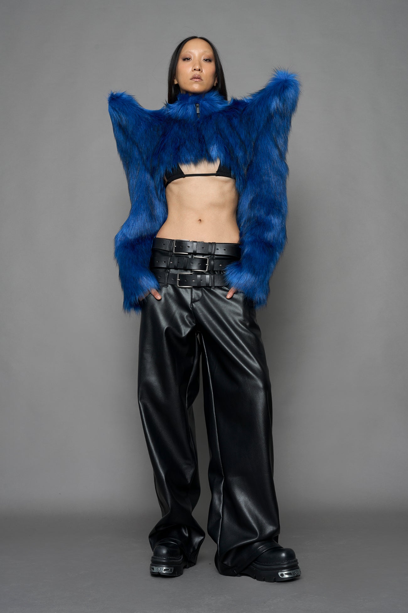 model wearing blue faux fur bolero jacket