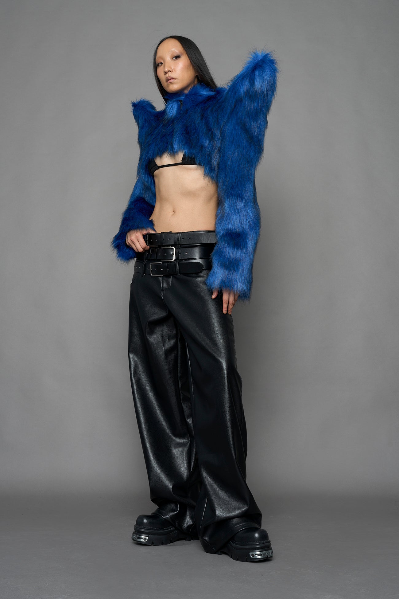 model wearing blue faux fur bolero jacket