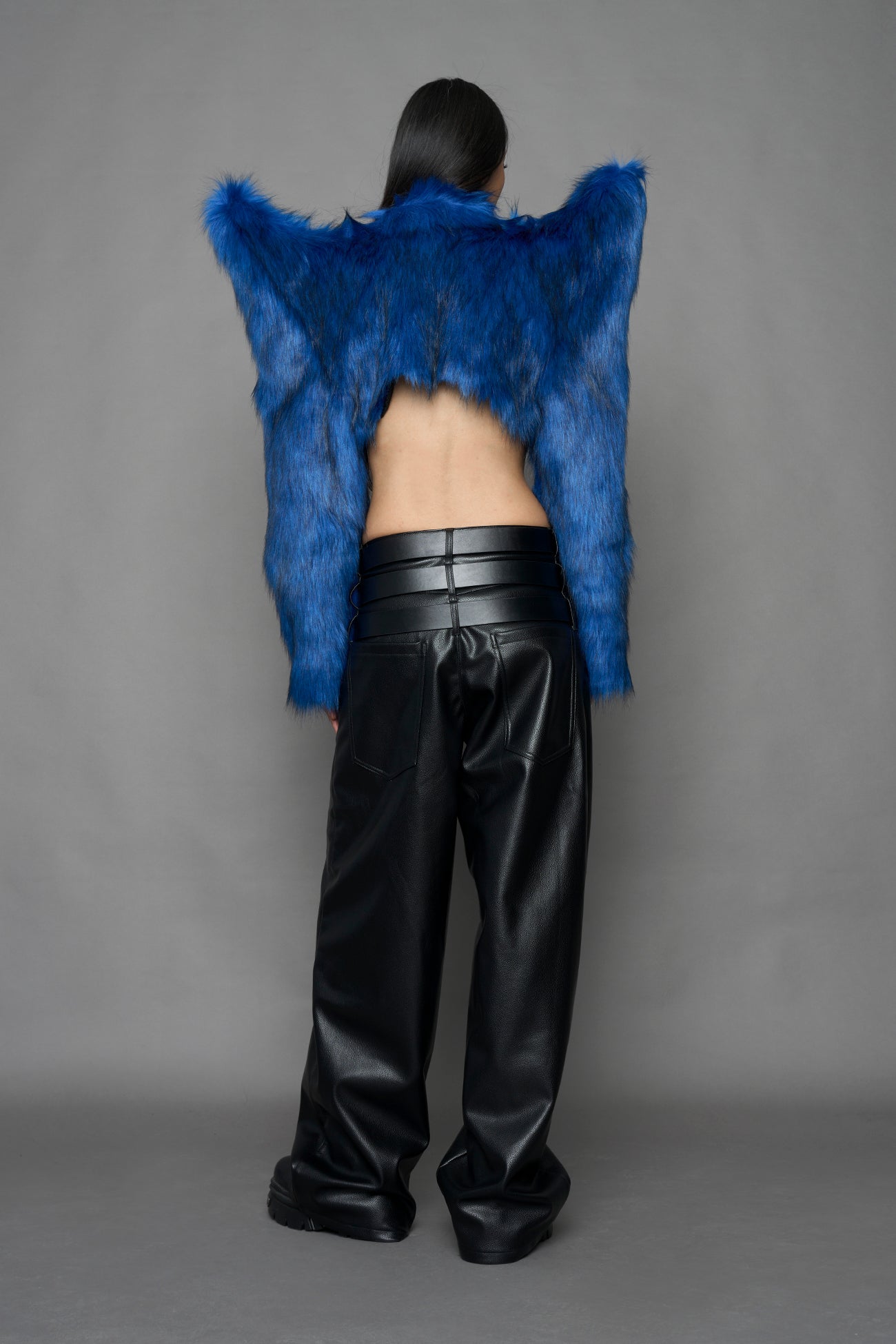 model wearing blue faux fur bolero jacket
