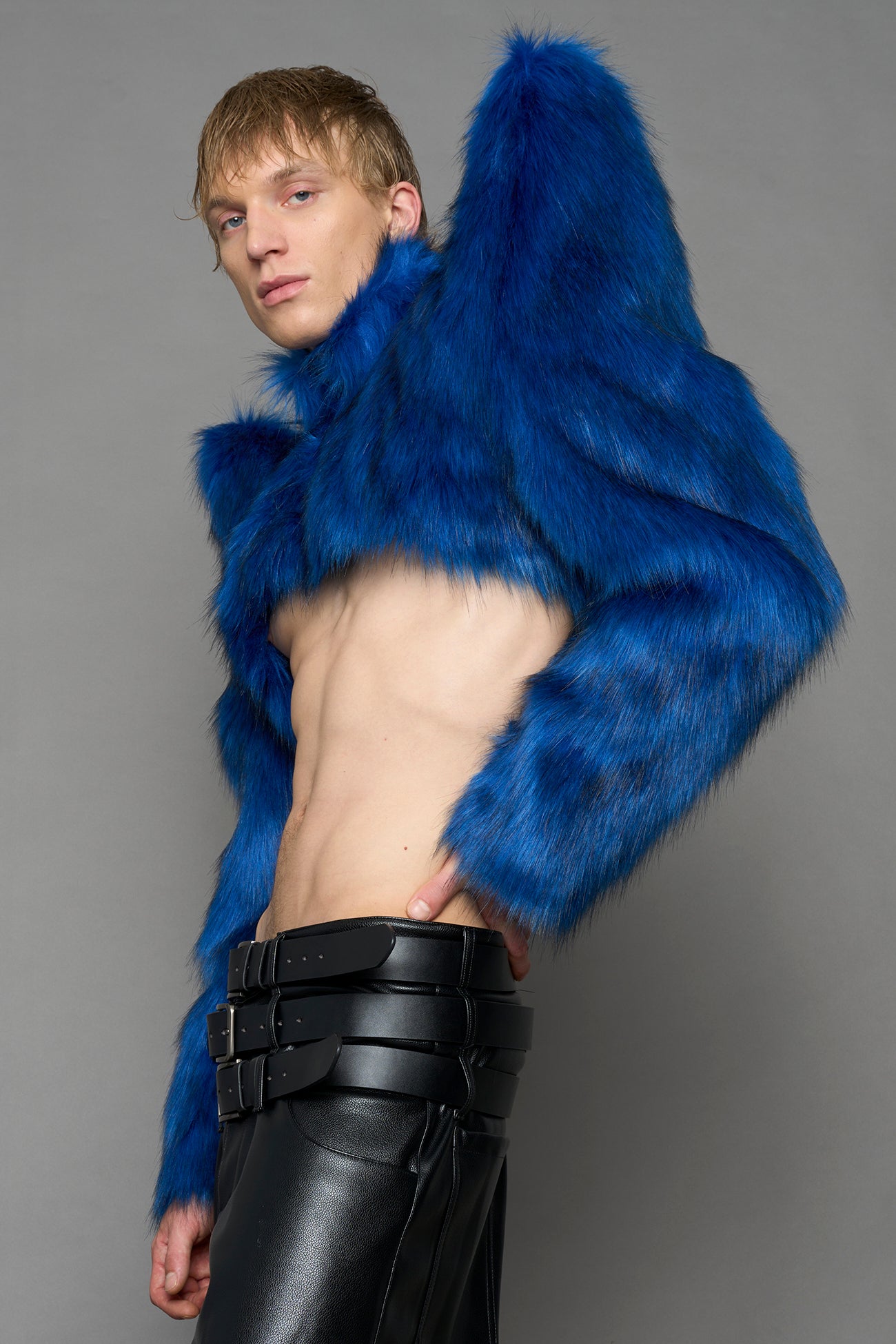 model wearing blue faux fur bolero jacket