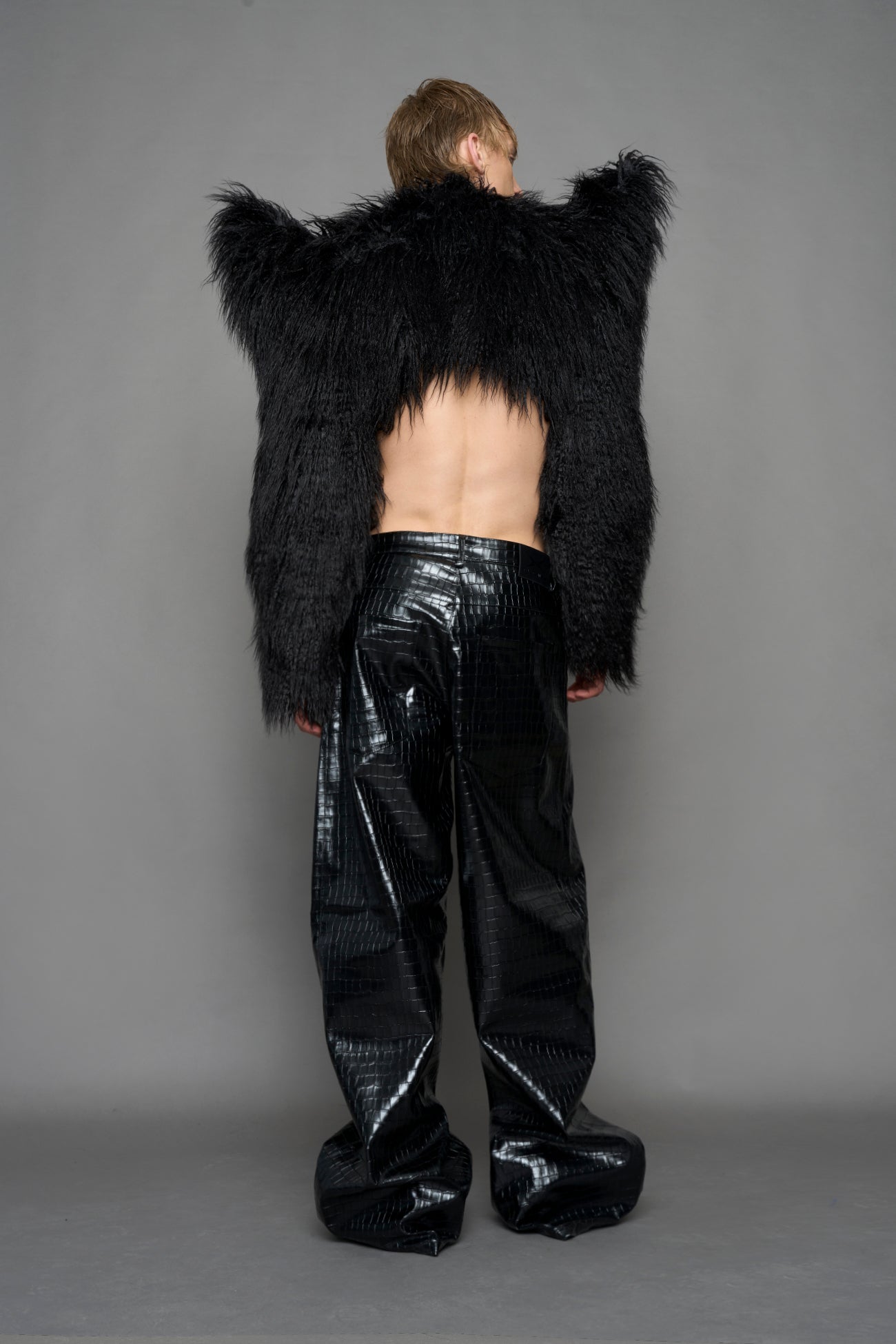 model wearing black faux fur bolero jacket