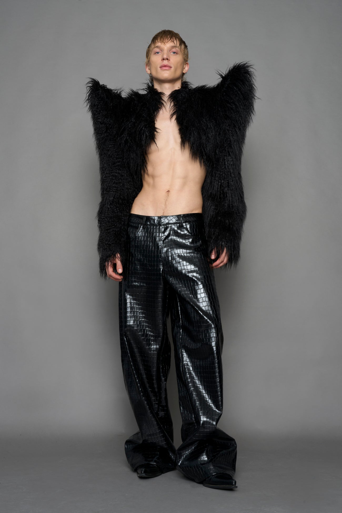 model wearing black faux fur bolero jacket