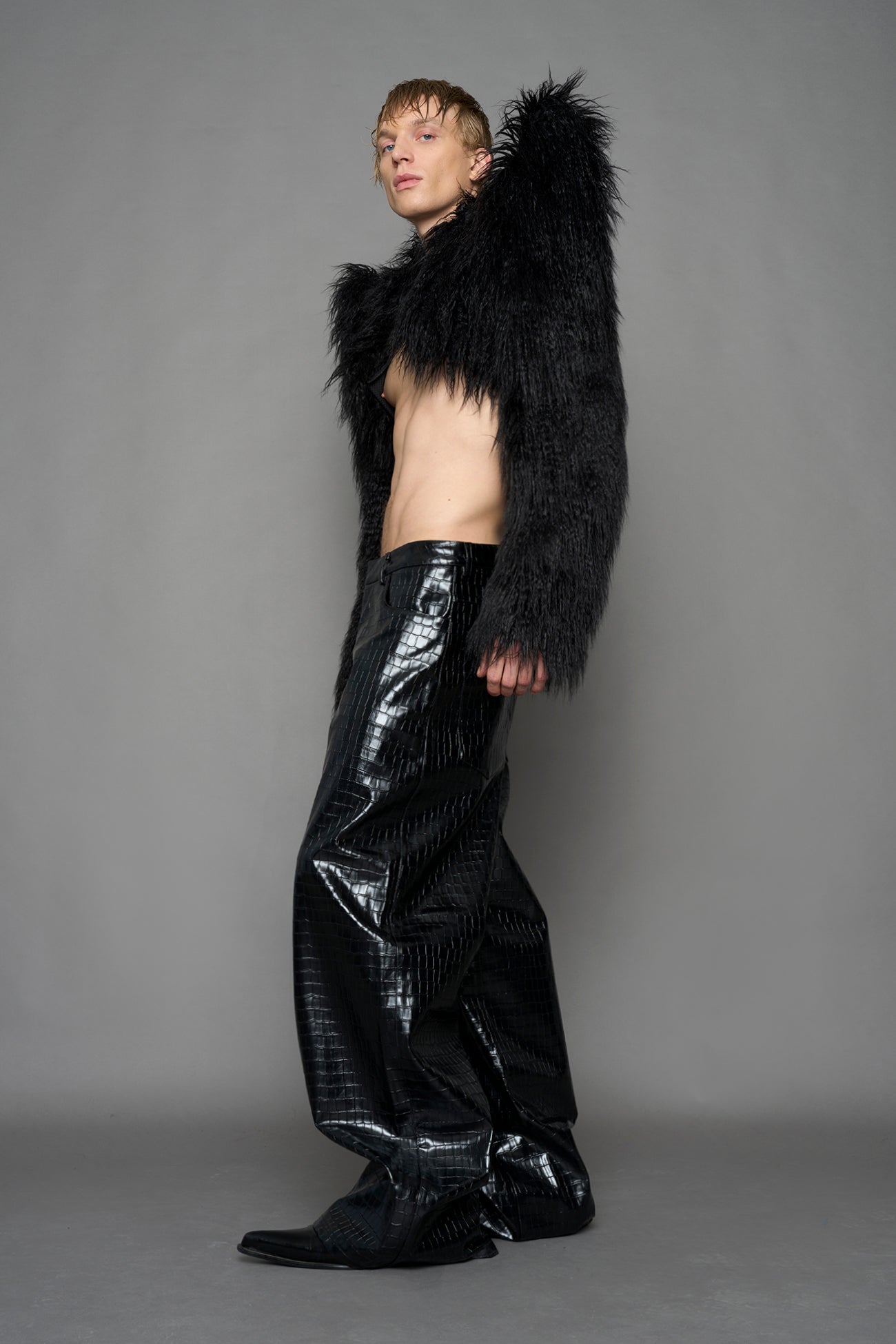 model wearing black faux fur bolero jacket