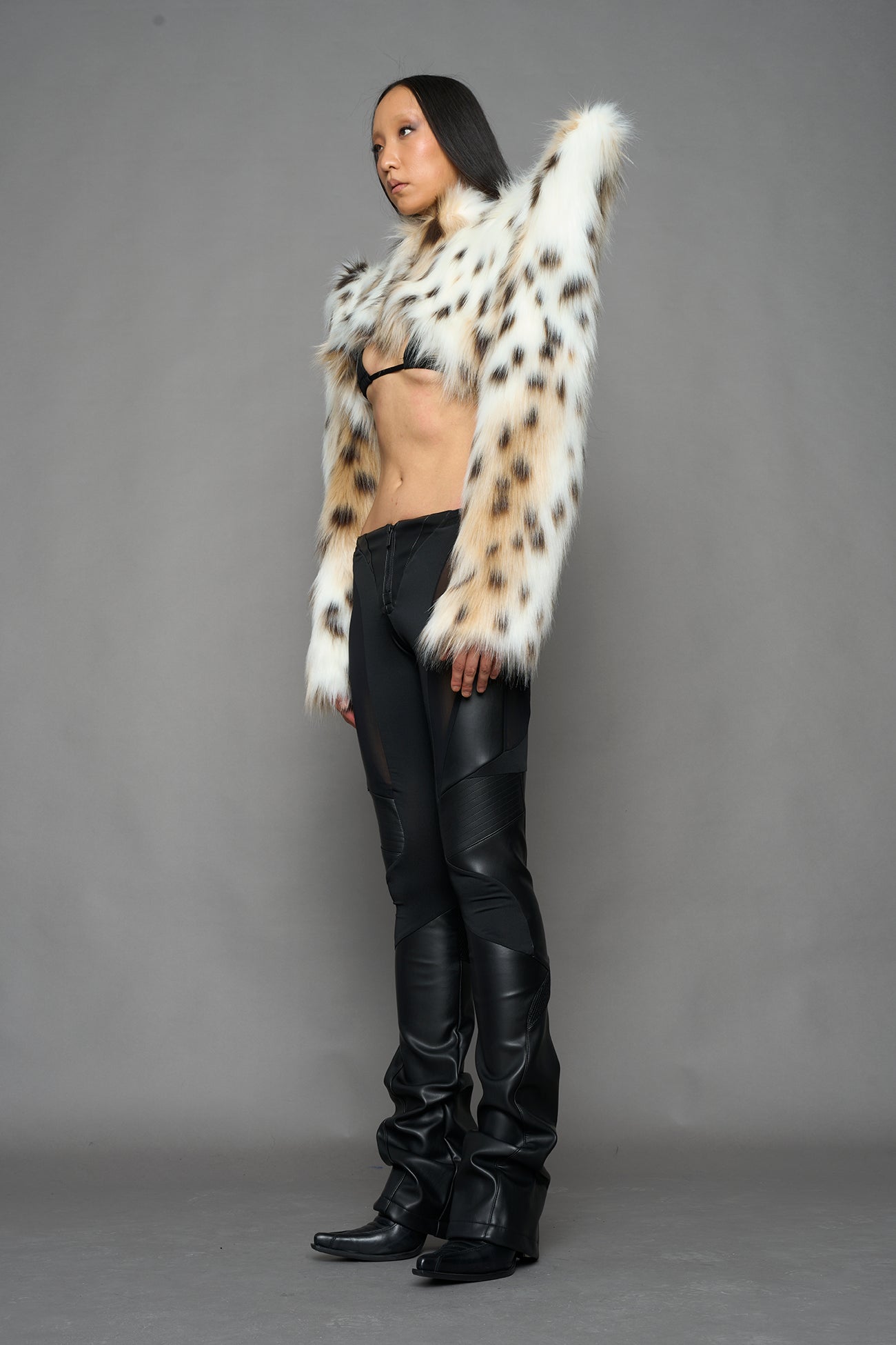 model wearing beige faux fur bolero jacket