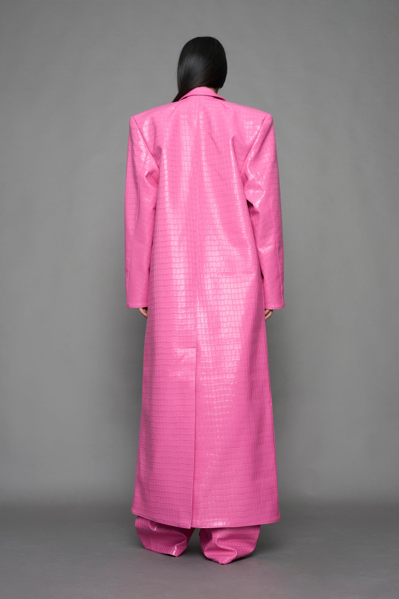 model wearing pink vegan croc leather long blazer coat 