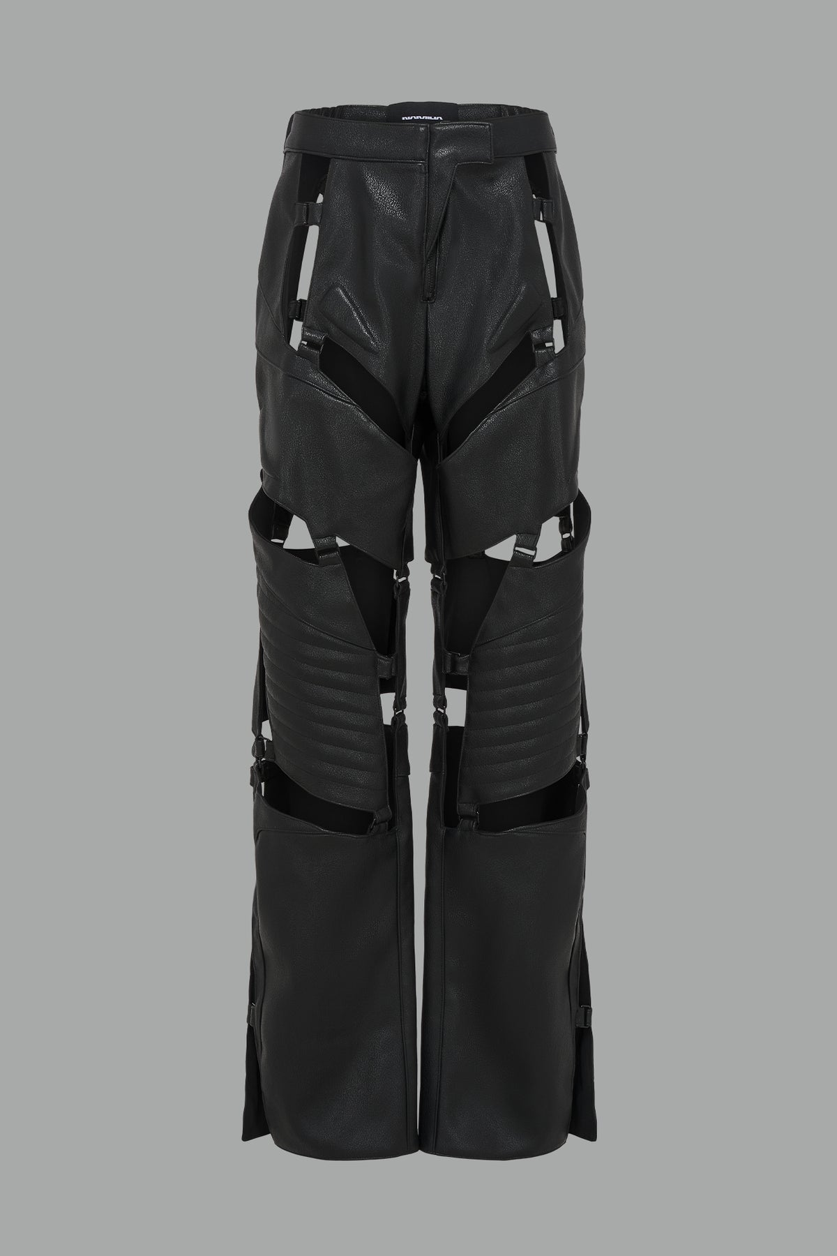  black vegan leather motocross-inspired pants with thigh cut-outs, strap harness details, quilted knee padding