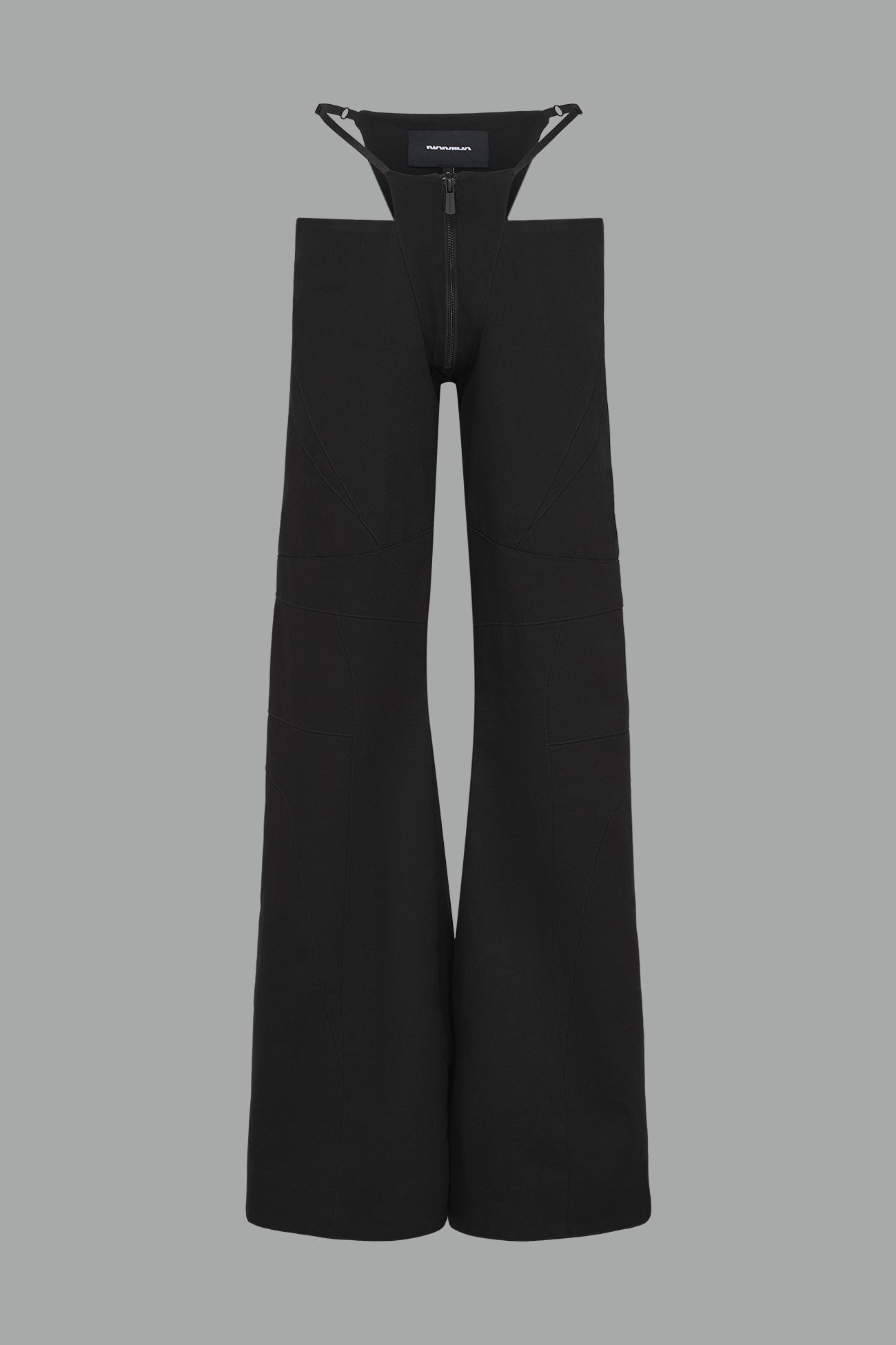 Low-rise flared pants in black cotton twill with bold side cut-outs and thong strap detailing.
