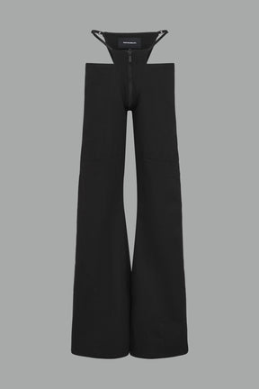 Low-rise flared pants in black cotton twill with bold side cut-outs and thong strap detailing.