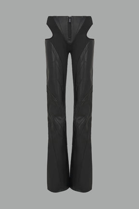 Black cut-out flare pants with graphic details, vegan leather panels, and low-rise waist – edgy motocross-inspired trousers for men’s streetwear or festival looks.