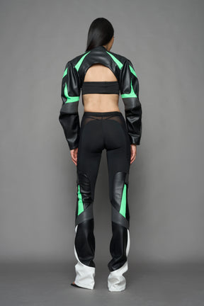 two models wearing black white green moto inspired mesh pants with logo on the leg