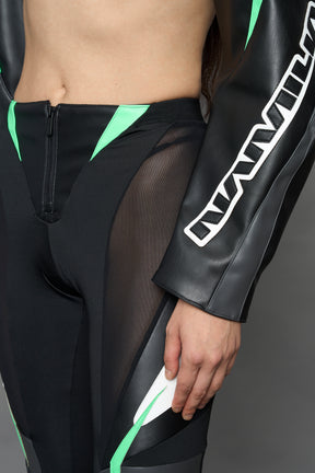 two models wearing black white green moto inspired mesh pants with logo on the leg