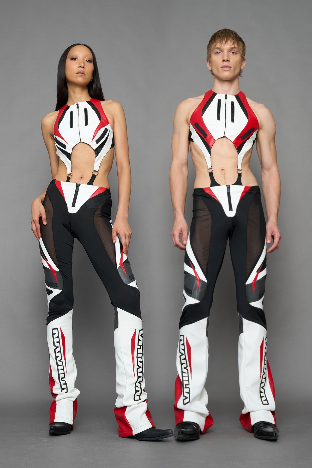two models wearing red black white moto inspired mesh pants with logo on the leg