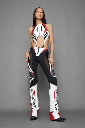 model wearing red black white moto inspired mesh pants with logo on the leg
