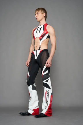 model wearing red black white moto inspired mesh pants with logo on the leg