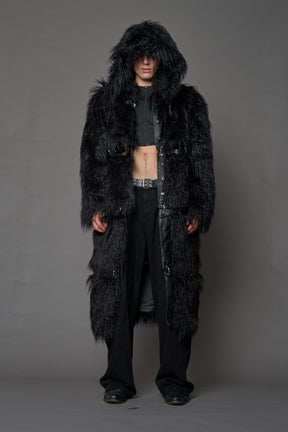 model wearing black faux fur coat with silver metal rings