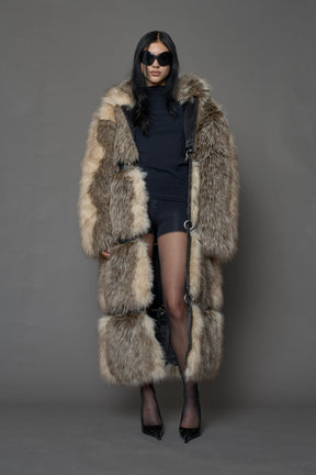 model wearing brown faux fur coat with silver metal rings
