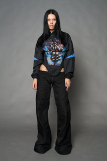 Black Namilia cropped tracksuit jacket with sleeve stripes, gothic graphic print, and lace-up corset back