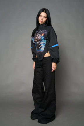 Black Namilia cropped tracksuit jacket with sleeve stripes, gothic graphic print, and lace-up corset back