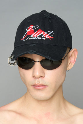 model wearing black red slogan embroidered rtrucker cap with silver ring details