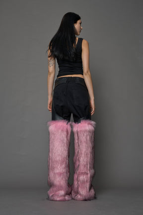 model wearing pink vegan leather and faux fur chaps
