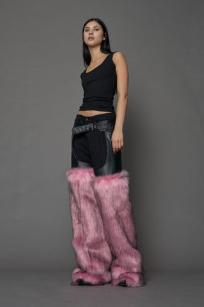 model wearing pink vegan leather and faux fur chaps