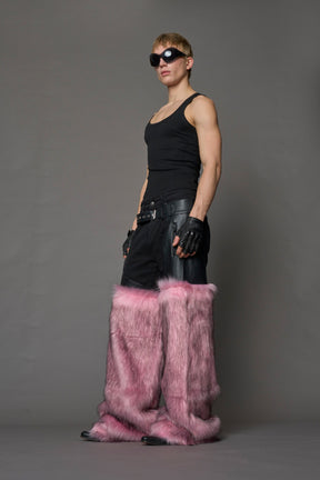 model wearing pink vegan leather and faux fur chaps