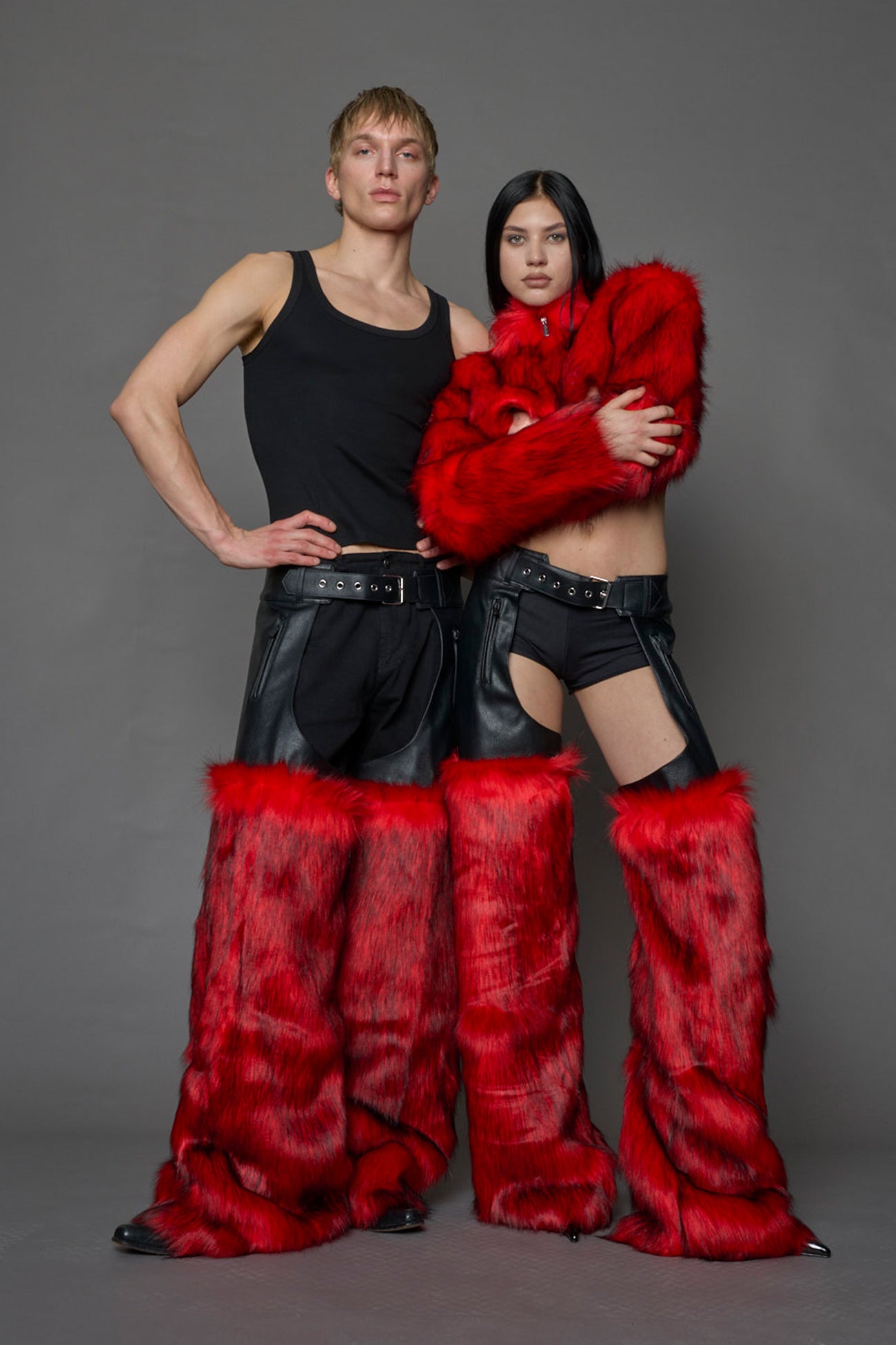 model wearing red vegan leather and faux fur chaps