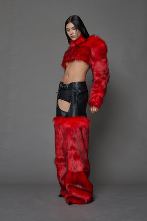 model wearing red vegan leather and faux fur chaps