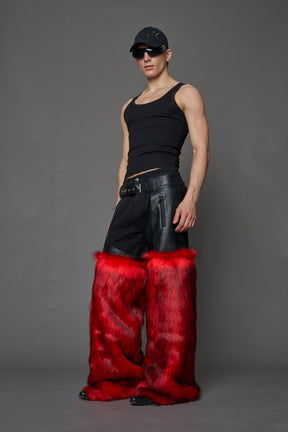 model wearing red vegan leather and faux fur chaps