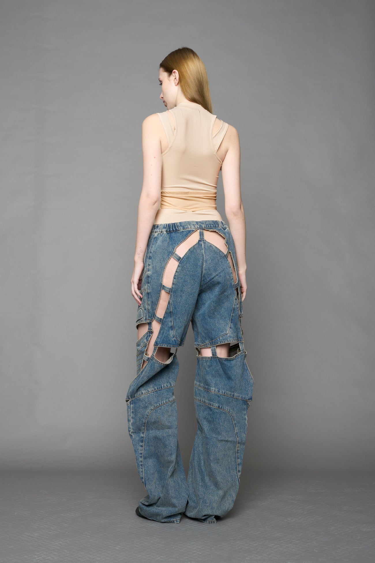 beige contour top by NAMILIA featuring a sculpted fit, corset-style waist with hook-and-eye closure, and high neckline. Statement shaping top.