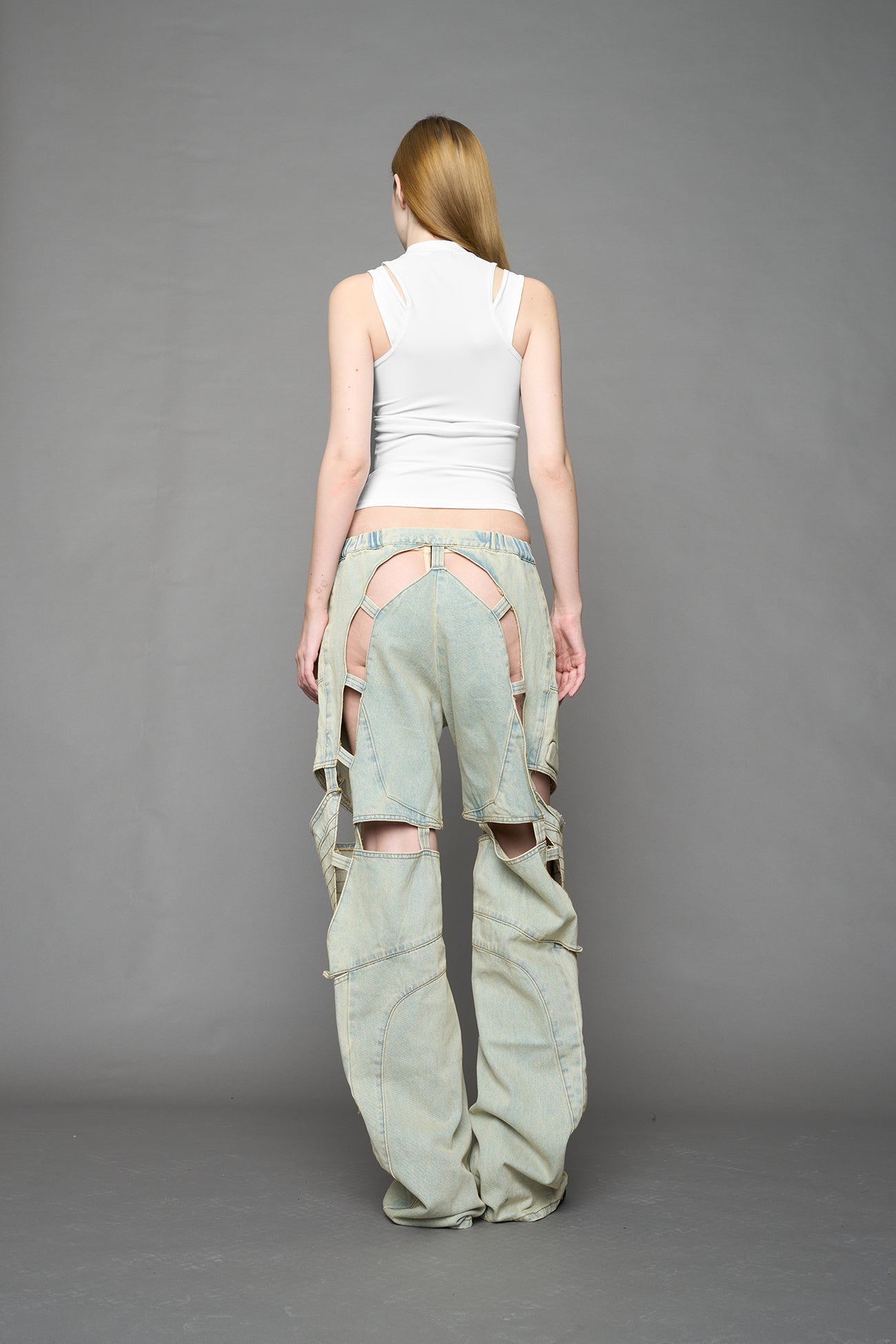 white contour top by NAMILIA featuring a sculpted fit, corset-style waist with hook-and-eye closure, and high neckline. Statement shaping top.