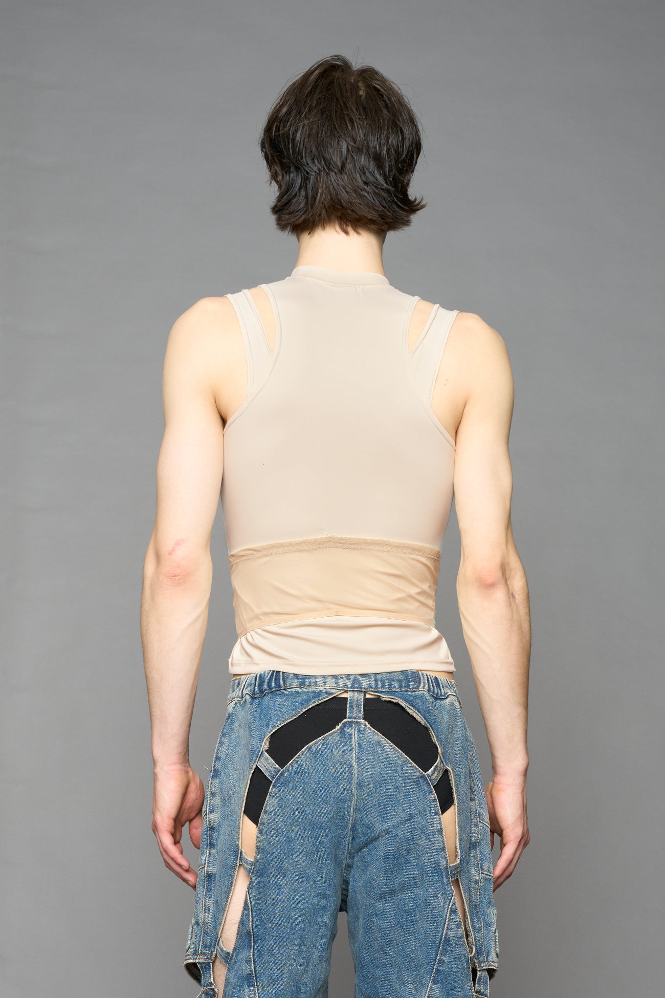 beige contour top by NAMILIA featuring a sculpted fit, corset-style waist with hook-and-eye closure, and high neckline. Statement shaping top.