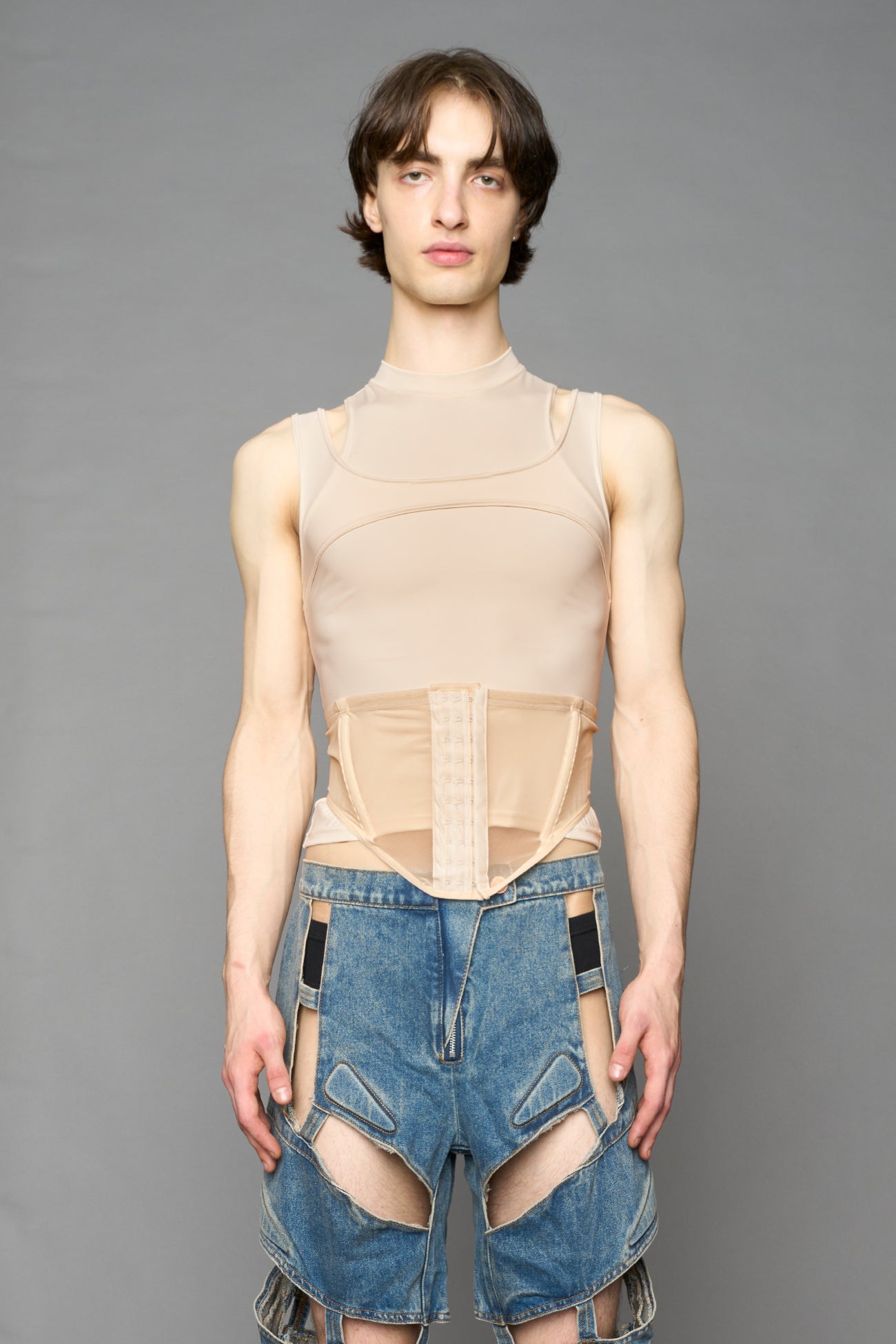 beige contour top by NAMILIA featuring a sculpted fit, corset-style waist with hook-and-eye closure, and high neckline. Statement shaping top.