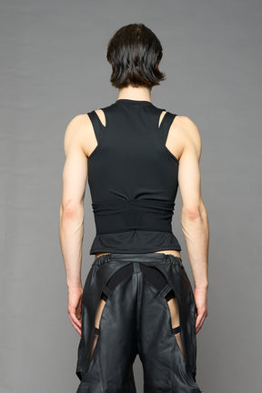 Black contour top by NAMILIA featuring a sculpted fit, corset-style waist with hook-and-eye closure, and high neckline. Statement shaping top.