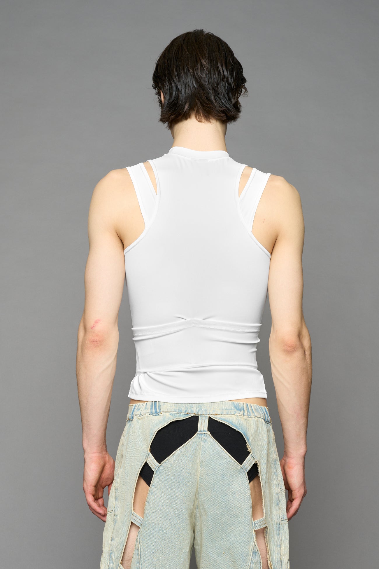 white contour top by NAMILIA featuring a sculpted fit, corset-style waist with hook-and-eye closure, and high neckline. Statement shaping top.