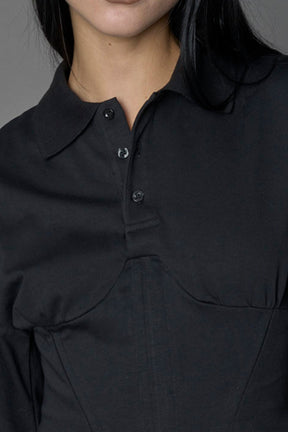 Model wearing a Polo shirt inspired black corset with lacing on the back