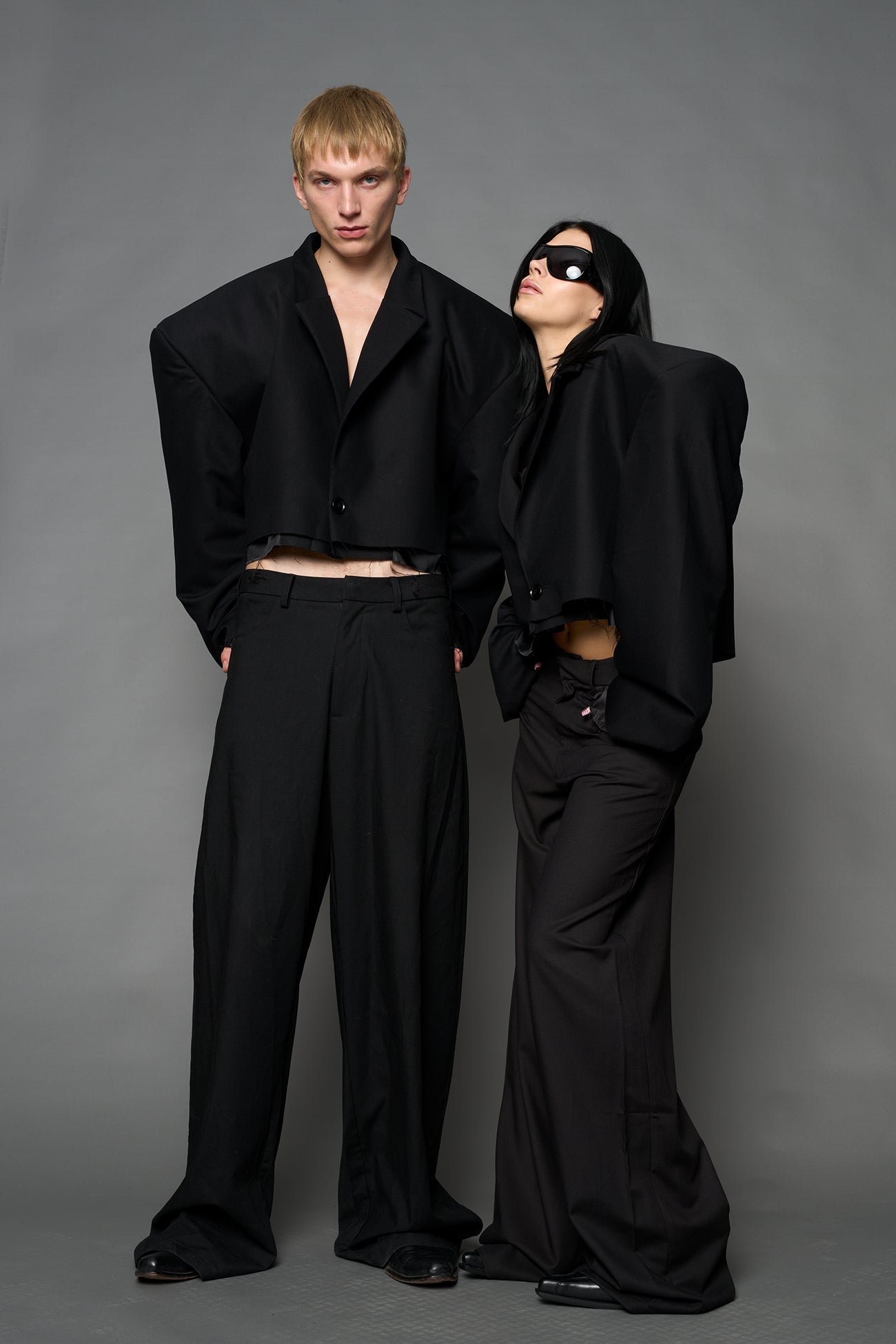 Black Namilia cropped blazer with oversized padded shoulders, single button closure and boxy silhouette