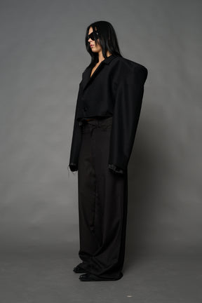 Black Namilia cropped blazer with oversized padded shoulders, single button closure and boxy silhouette