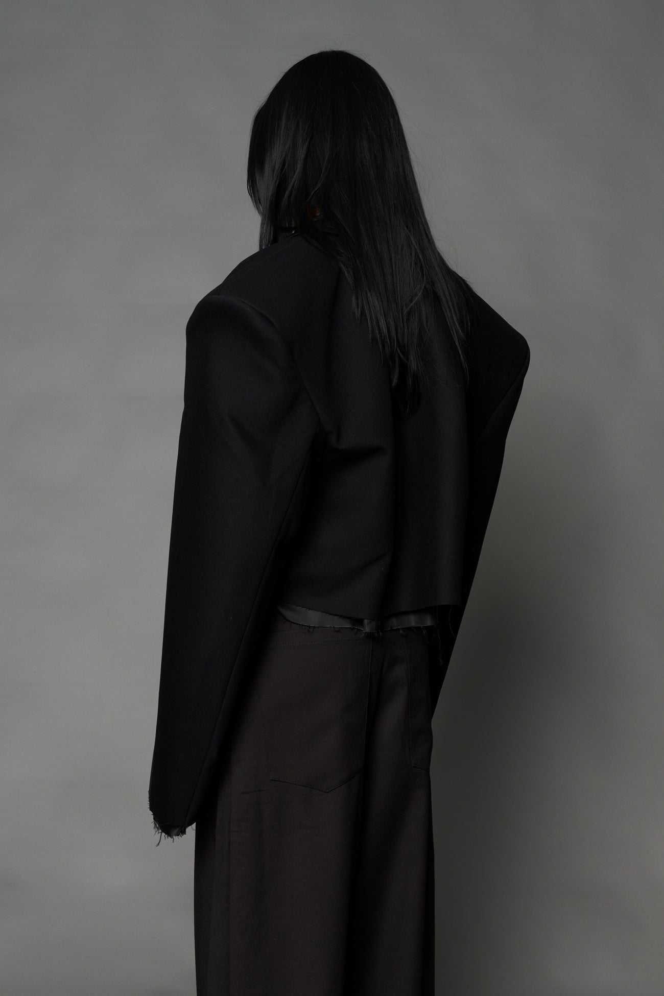 Black Namilia cropped blazer with oversized padded shoulders, single button closure and boxy silhouette