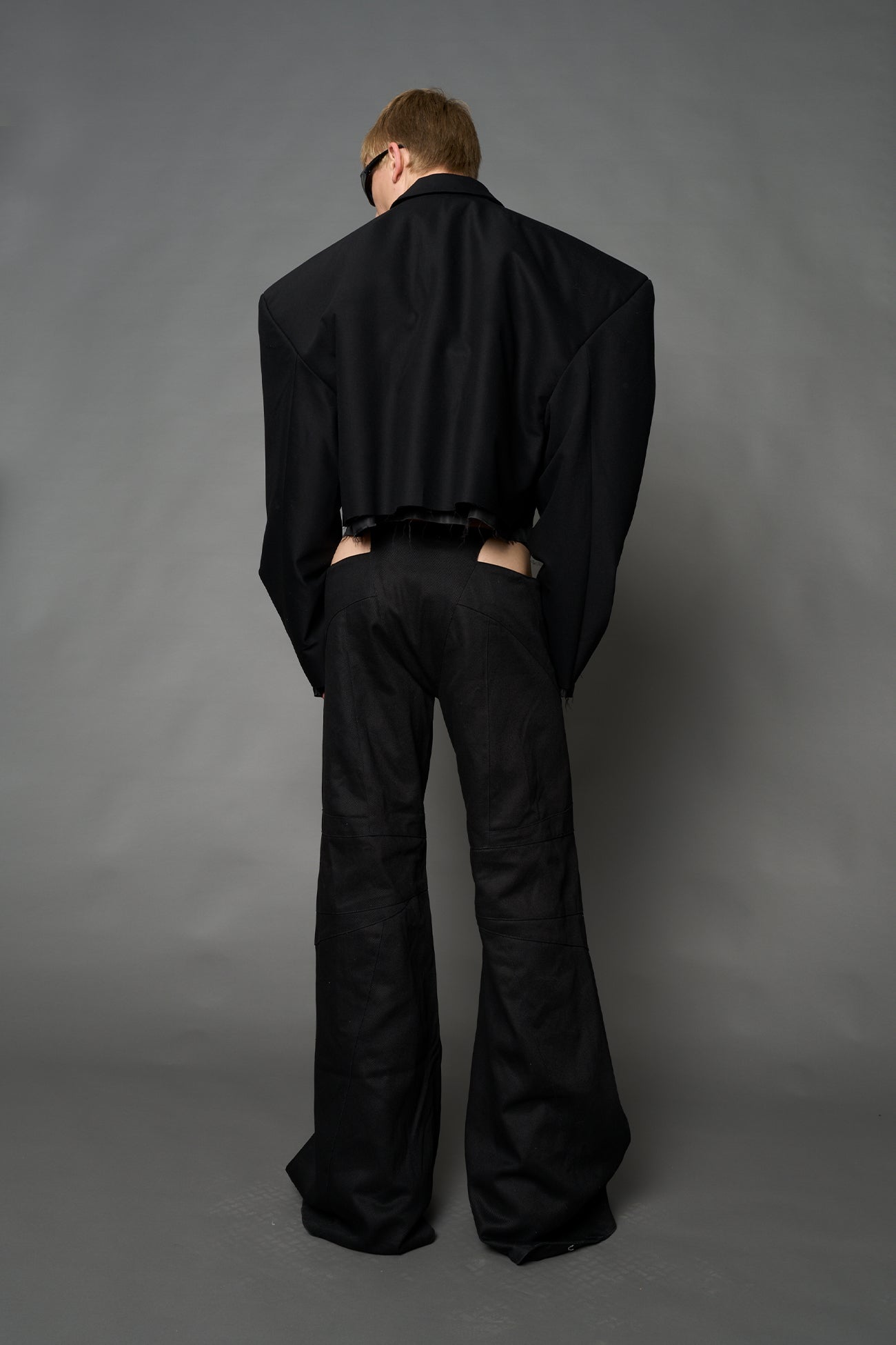 Black Namilia cropped blazer with oversized padded shoulders, single button closure and boxy silhouette